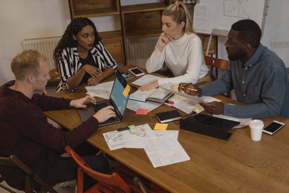 Professionals discussing ideas in a meeting